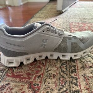 On Running Gray and White Sneakers with Cloud Cushioning
